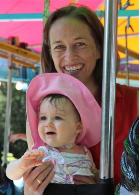 Bayley Allred and her mom Claire take a ride on the carousel. KYRIL BROMLEY