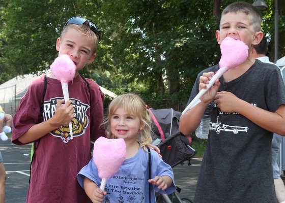 Loving those cotton candy cones are Hunter and Kailey Eberhart and Nick Schaffer. KYRIL BROMLEY