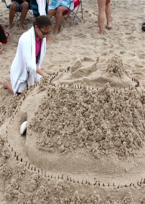 Evan Kern creates a sandcastle for the sandcastle contest. KYRIL BROMLEY
