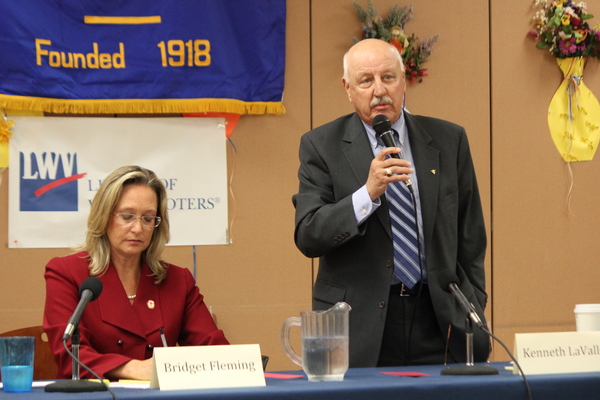 New York State Senator Kenneth LaValle answers a question while Southampton Town Councilwoman Bridget Fleming takes notes during the debate Monday night. CAROL MORAN