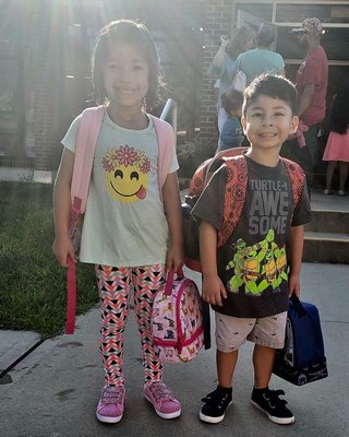  Karyme Hurtado and Bailey Grant on their first day of school.  COURTESY JAMES STEWART
