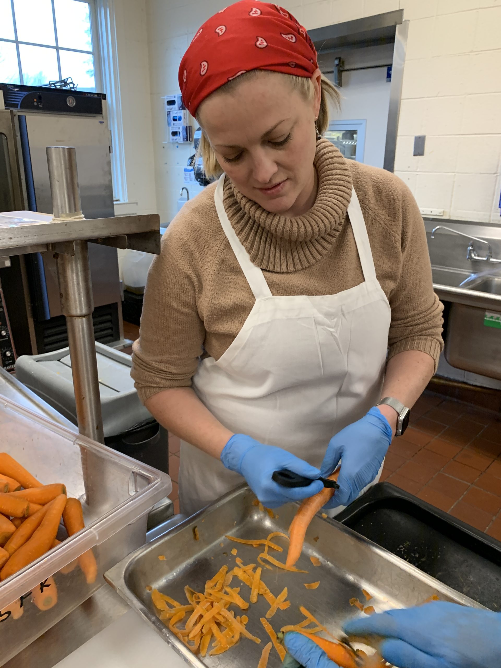 Volunteers helped wash, peel, chop and freeze 1,600 pounds of carrots to be sent to a food bank. KIM COVELL