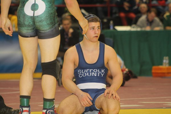 ESM's Jimmy Leach (138 pounds) after losing