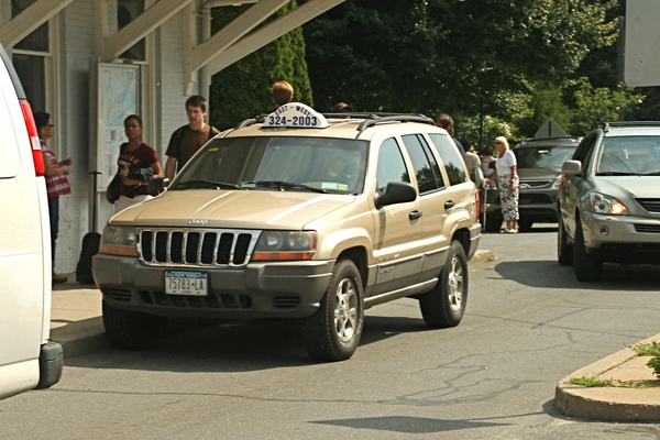A taxi waits to pick up passengers at the East Hampton train stiation. 