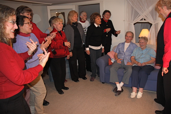 Members of the Sweet Adelines serendade Bob and Olive Hildreth of Collins Avenue on their 70th anniversary on Valentine’s Day. 