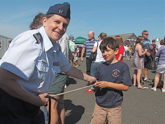  enthusiastic crowd turned out on a beautiful Saturday for Sag Harbor's Harborfest festivities. BY KYRIL BROMLEY