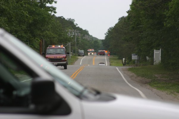  fire and emergency medical services agenecies responded to a mulch fire on June 26 off of Speon-Riverhead Road in Speonk. The road was closed for about three hours while responders surpressed the flames. KYLE CAMPBELL