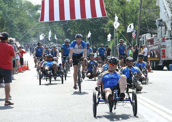 Organizer Chris Carney leads the troops into Sag Harbor. KYRIL BROMLEY