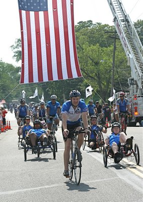 Organizer Chris Carney leads the troops into Sag Harbor. KYRIL BROMLEY