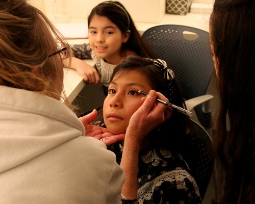 Students get their makeup done.