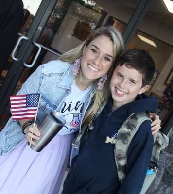 Last week, Raynor Country Day School celebrated the annual, international celebration called See You at the Pole. During this yearly event, the students, staff, family, friends, and community members gather at the school's flagpole in a celebration of the new school year. Teacher Leah Lettieri joins her student fifth-grader Kevin Kelly at the flagpole.