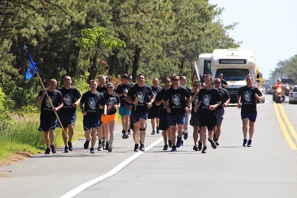 Eight officers from the East Hampton Town Police Department were among dozens from across the East End who participated in a Law Enforcement Torch Run on Tuesday to benefit Special Olympics New York. The 13-mile run began in Montauk and ended at the East Hampton Village Emergency Services Building.  KYRIL BROMLEY