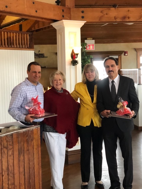 The Hampton Bays Beautification Association presented its annual awards at its holiday party last week. FMichael Braun of Silver Bay Lending, left, and Kenneth Pagano of Allstate Insurance were given the group's Community Beautification Award for 2019. ValerieZuccarelli and Susan von Freddi, second from right, made the presentation. 