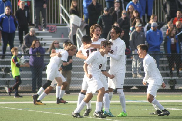 November 9 -- The Whalers celebrate their victory in the Long Island Class C Championship. They reached the New York State Championships for the first time in program history this past fall.