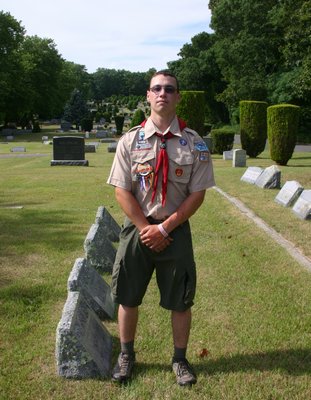  of Hampton Bays stands in Good Ground Cemetery where he is working on a service project to achieve the organization's highest honor: Eagle Scout. KYLE CAMPBELL