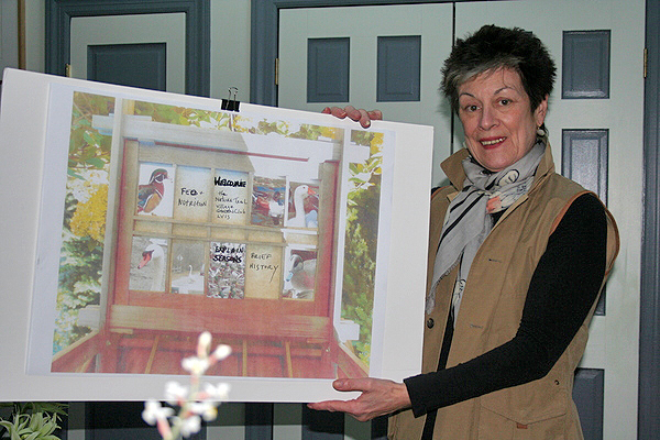 Dianne Benson with a mockup of informative panels for visitors to the Nature Trail in East Hampton Village. VIRGINIA GARRISON