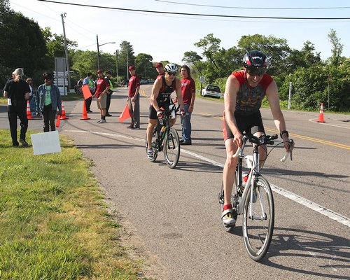 Scenes from the 34th annual Robert J. Aaron Memorial Mighty Montauk Triathlon on Saturday. KYRIL BROMLEY