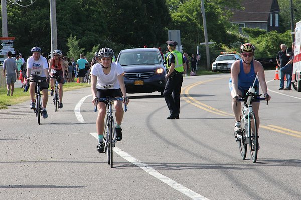 Scenes from the 34th annual Robert J. Aaron Memorial Mighty Montauk Triathlon on Saturday. KYRIL BROMLEY