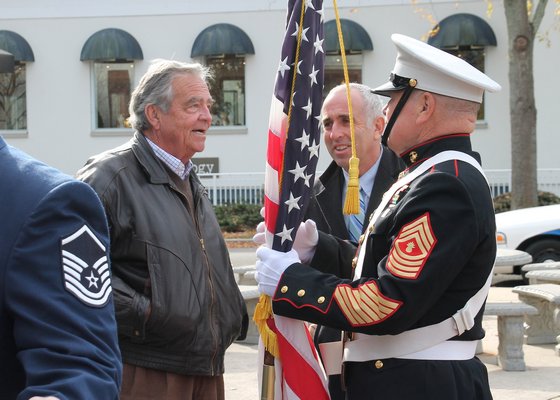 Mayor Paul Rickenbach and Suffolk County Legislator Jay Schneiderman chat with U.S. Marine Brian Carabine. KYRIL BROMLEY PHOTOS