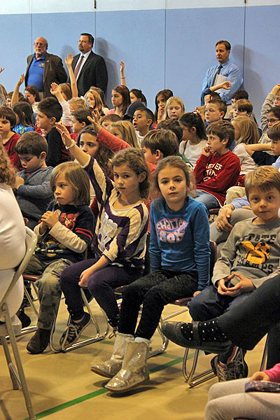 Remsenburg-Speonk Elementary students ask questions during an assembly with members of the  Air National Guard 106th Rescue Wing. CAROL MORAN