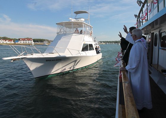 Boats were blessed and lost ones honored at the Blessing of the Fleet in Montauk on Sunday. KRYIL BROMLEY