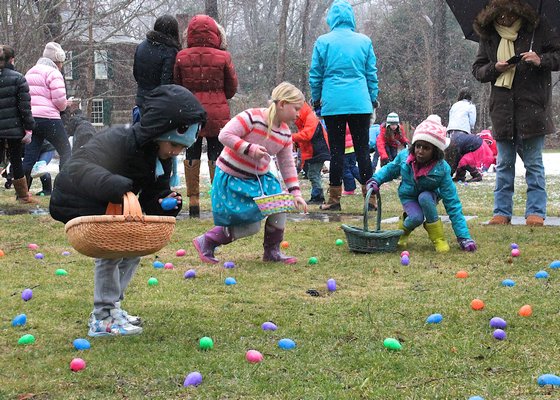 A group of hardy hunters turned out on a damp Saturday morning with sprinkles of snow in the air for the Ladies Village Improvement Society of East Hampton annual Easter Egg Hunt. KYRIL BROMLEY
