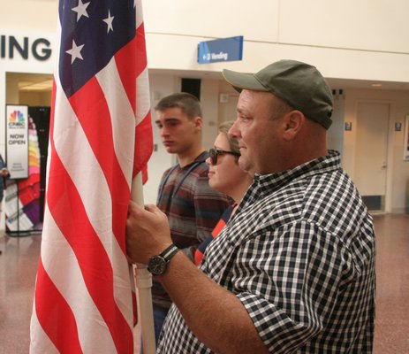  in the terminal at MacArthur Airport on Saturday afternoon. Dozens of family members welcomed Spc. Kuroski home after a nine month deployment in Afghanistan. KYLE CAMPBELL