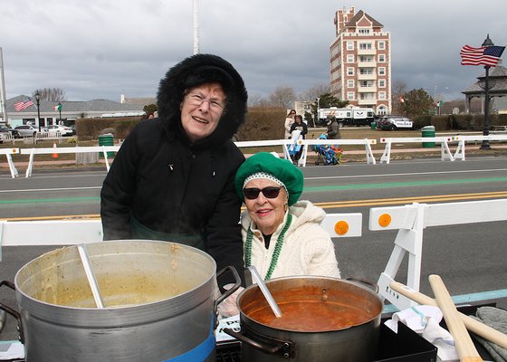 Maureen Veprek and Pat Gilchrest with chowder that warmed the spectators at Sunday's St. Patrick's Day parade in Montauk on  Sunday.    KYRIL BROMLEY
