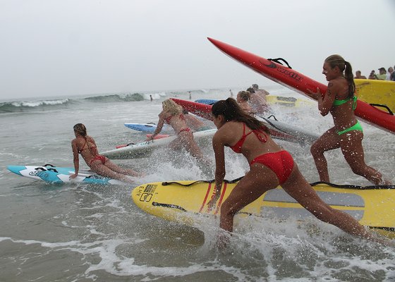 Lifeguards head out into the water. KYRIL BROMLEY