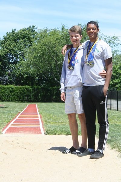 Jesse Scanlon (right) and Sebastian Pereira finished one-two in the long jump (Division II) at the state championships in 
