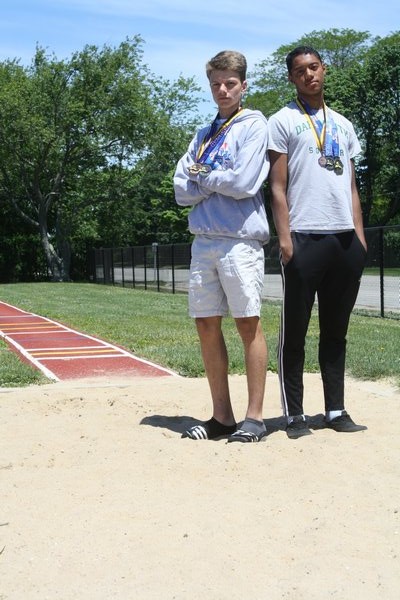 Jesse Scanlon (right) and Sebastian Pereira finished one-two in the long jump (Division II) at the state championships in Syracuse over the weekend. CAILIN RILEY