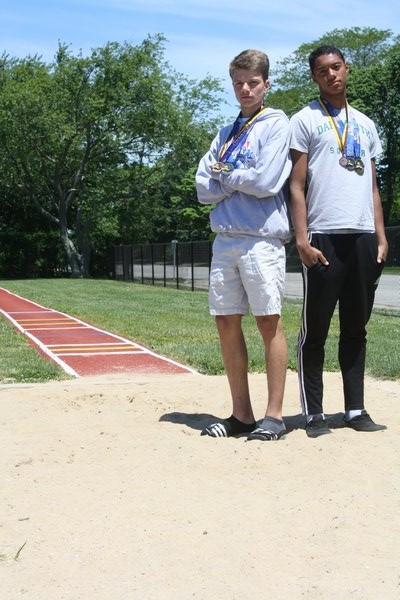 Jesse Scanlon (right) and Sebastian Pereira finished one-two in the long jump (Division II) at the state championships in Syracuse over the weekend.  CAILIN RILEY CAILIN RILEY