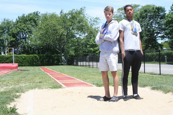 Jesse Scanlon (right) and Sebastian Pereira finished one-two in the long jump (Division II) at the state championships in Syracuse over the weekend. CAILIN RILEY