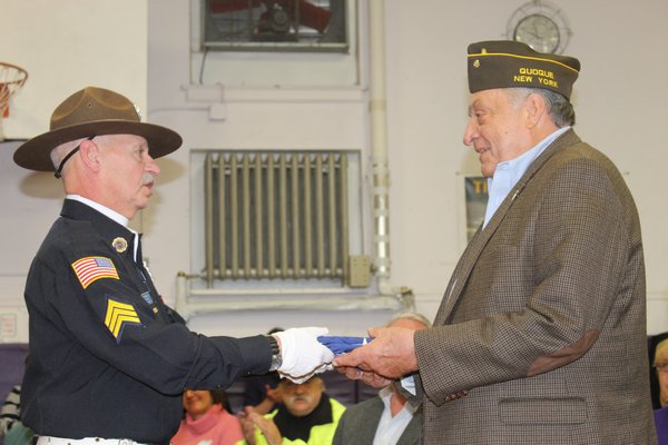  presents Hampton Bays resident Jack Kampf with four medals recognizing his service in the Korean War during the Hampton Bays Elementary School veteran of the month ceremony on Friday. KYLE CAMPBELL