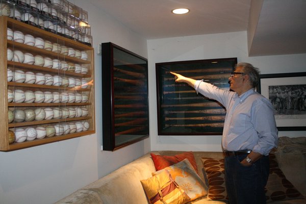 Rick Friedman has created his own mini baseball hall of fame in the basement of his Southampton home. CAILIN RILEY