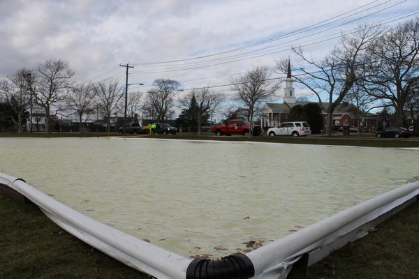 The Westhampton Beach Public of Works Department set up an ice skating rink on the village's Great Lawn across from St. Mark's Episcopal Church on Main Street on Monday morning
. KYLE CAMPBELL