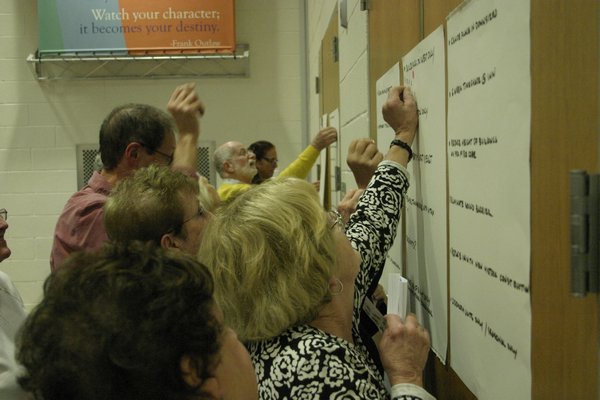 Hampton Bays residents clamor to vote for alternatives to the Canoe Place Inn maritime planned development district Monday night at the Hampton Bays Middle School Cafetorium on Ponquogue Avenue. KYLE CAMPBELL