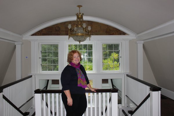 Brenda Sinclair Berntson stands at the top of the main staircase. VALERIE GORDON