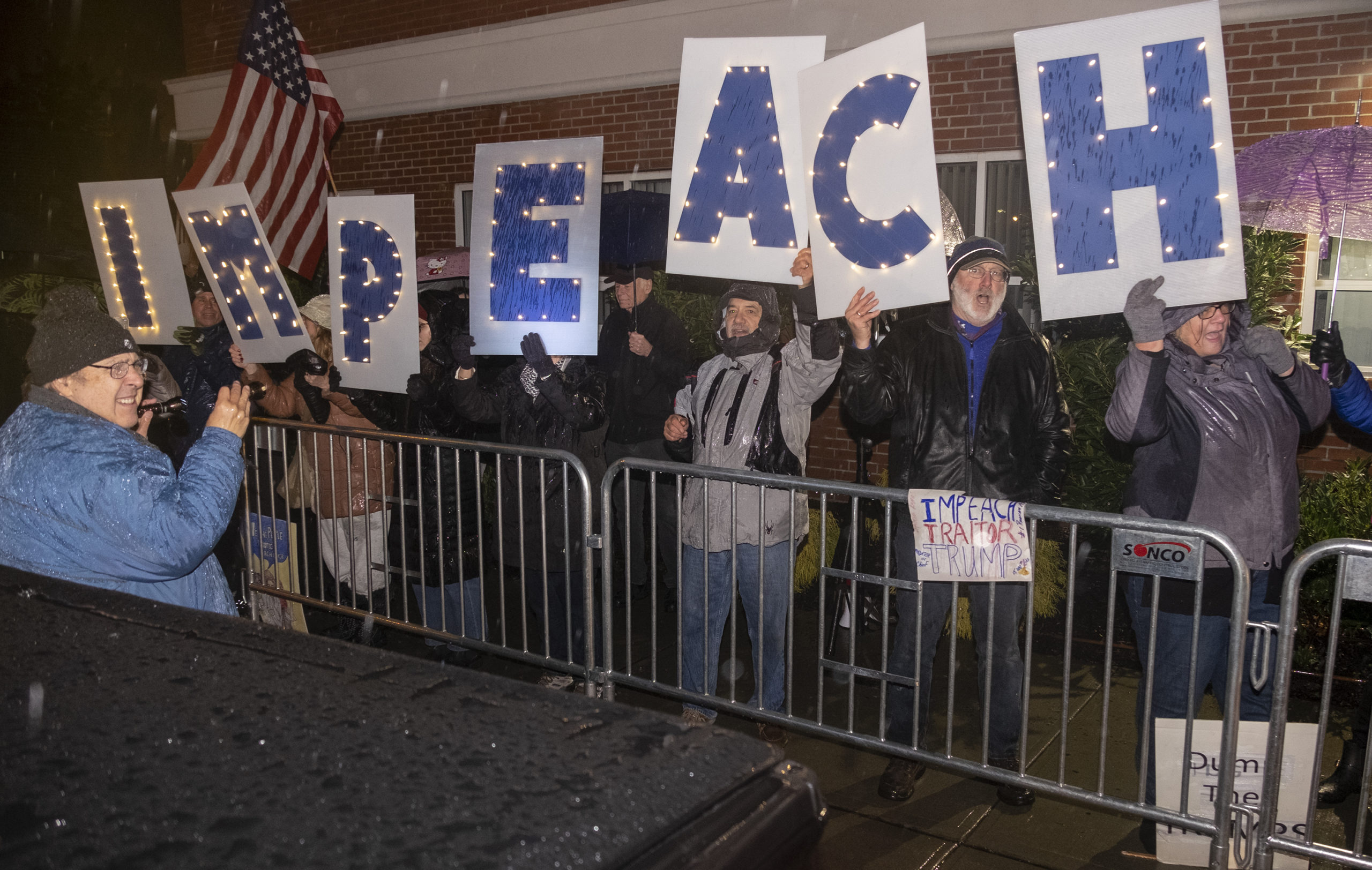 Protesters gathered outside U.S. Representative Lee Zeldin's offices earlier this week to demand he vote in favor of impeachment.