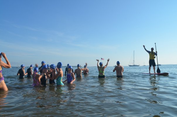 Swimmers wait for the start of the half-mile swim.