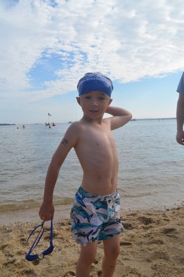 Six-year-old Marley Serrell of East Quogue was among the youngest swimmers in the event. His dad