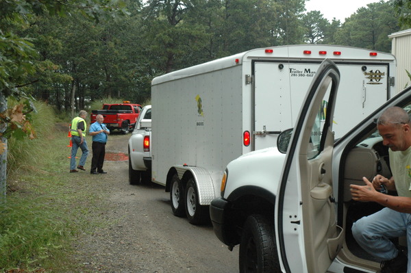 Workers waited to check in at a LIPA staging area on Industrial Road in Wainsccott next to the East Hampton Airport.