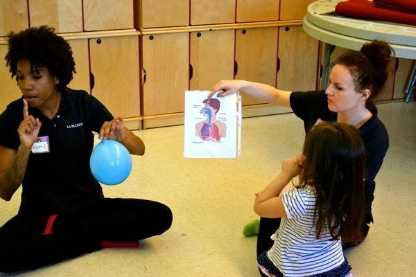 La Palestra Kids instructors teach children about anatomy and health at a work shop. COURTESY LA PALESTRA KIDS FOUNDATION