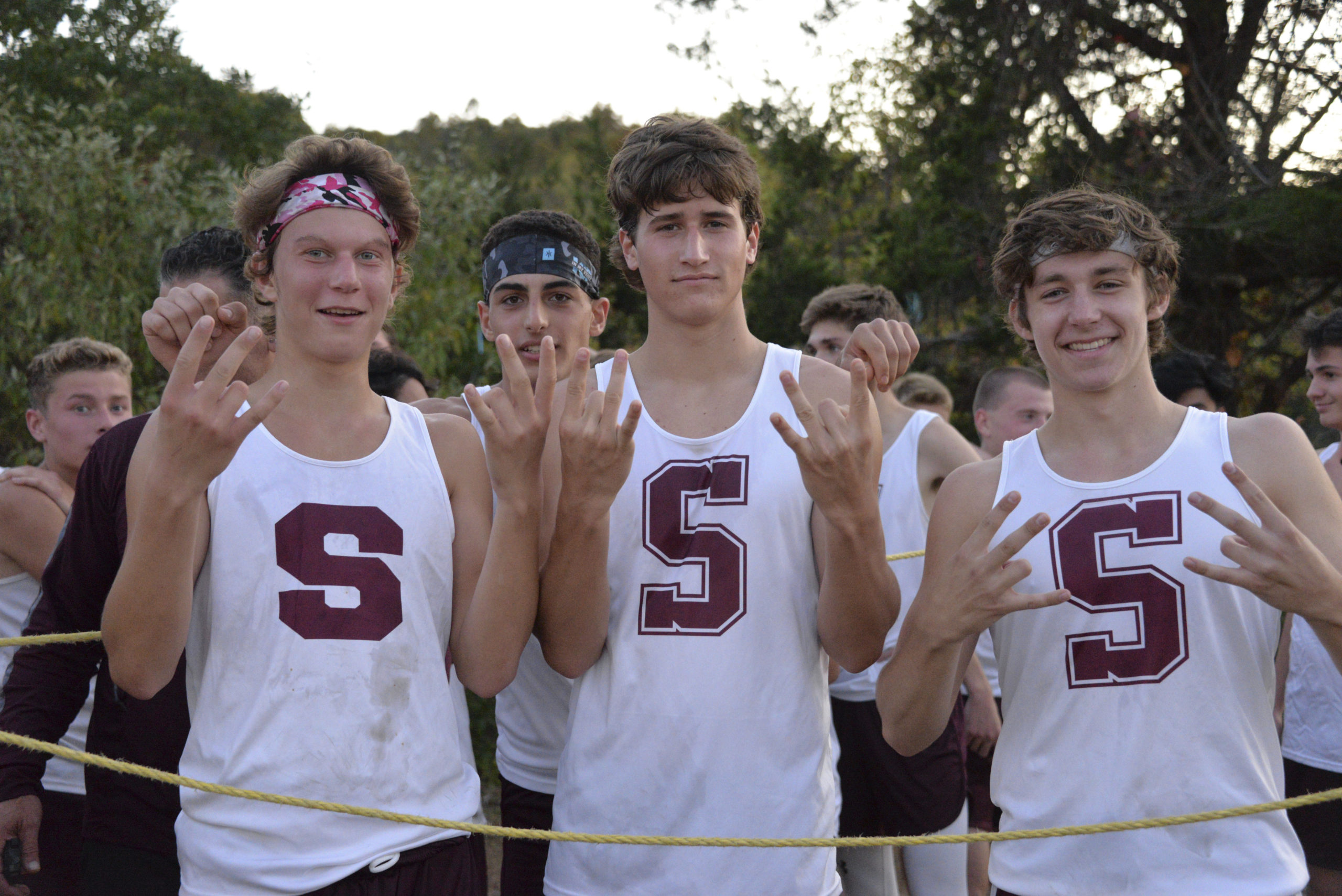 Count 'Em: Six Straight League Titles 
October 24 -- Southampton boys cross country team members Griffin Schwartz, Artemi Gavalas, Billy Malone and Zac Mobius hold up six for the amount of consecutive league titles the Mariners have won.