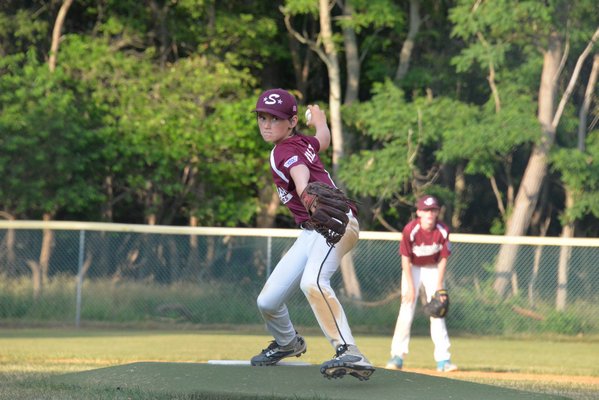 Ethan Walker gets ready to unload a pitch for the Southampton All-Stars in their first game against North Shore. MICHELLE MALONE