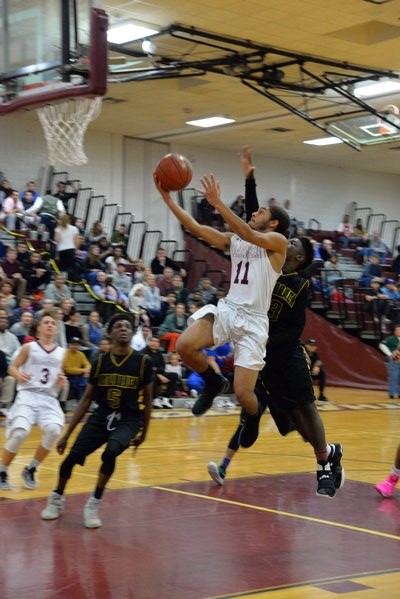 Southampton senior Andre Franklin drives in a for a layup. MICHELLE MALONE