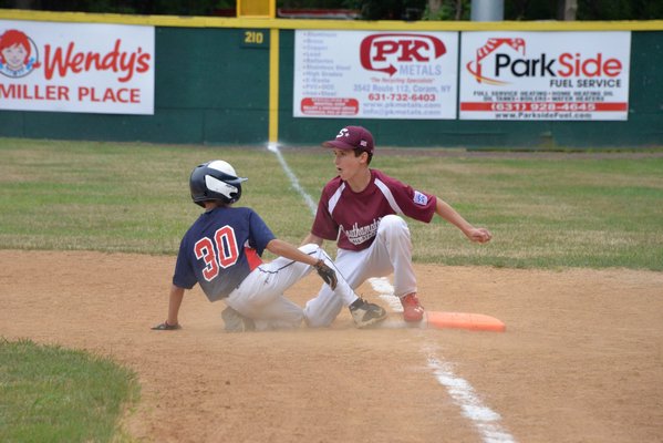 Billy Malone makes an out against North Shore. MICHELLE MALONE