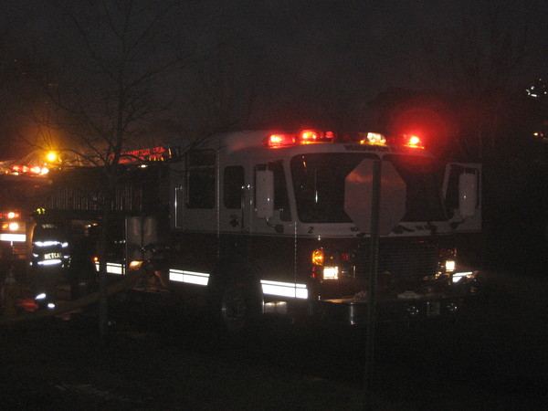 Westhampton Beach Fire Department volunteers rushed to the scene of a fire on Cook Street in Westhampton on Tuesday. LISA FINN