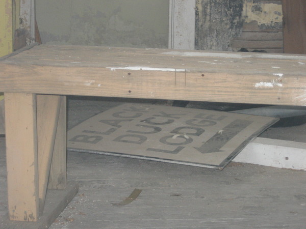 A look inside the window of the property shows a deteriorated interior