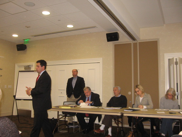 Members of the Citizens Advisory Committee-West listen as David Gallo describes a proposed 55 and over affordable rental development in Quiogue. 
